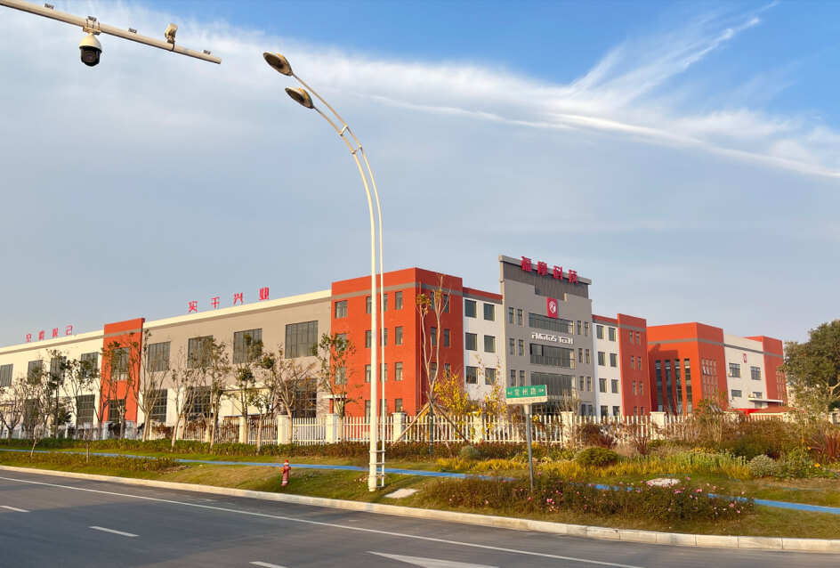 A big red building with a street light in front