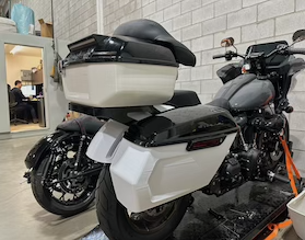 A motorcycle parked on a machine in a garage