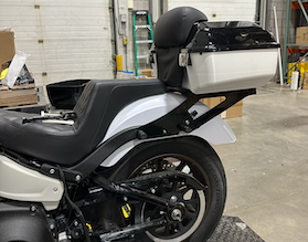 A motorcycle with a luggage rack on the back
