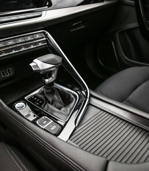 Interior of car with gear shift and steering wheel